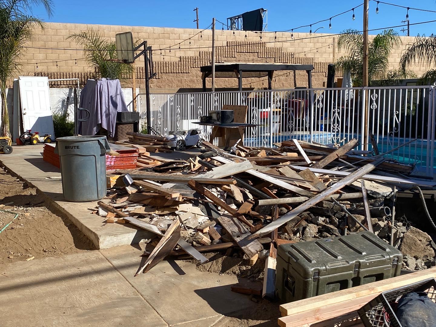 Before: backyard covered in construction debris