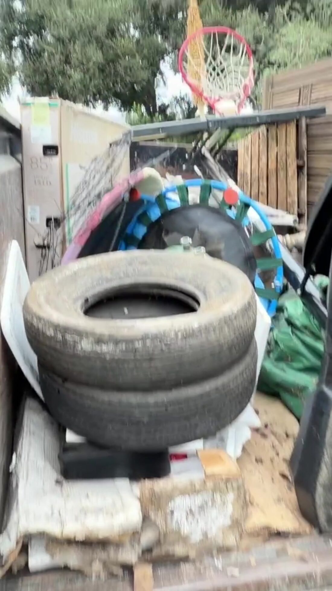 Trailer loaded with junk and yard debris from a Glendora backyard cleanout