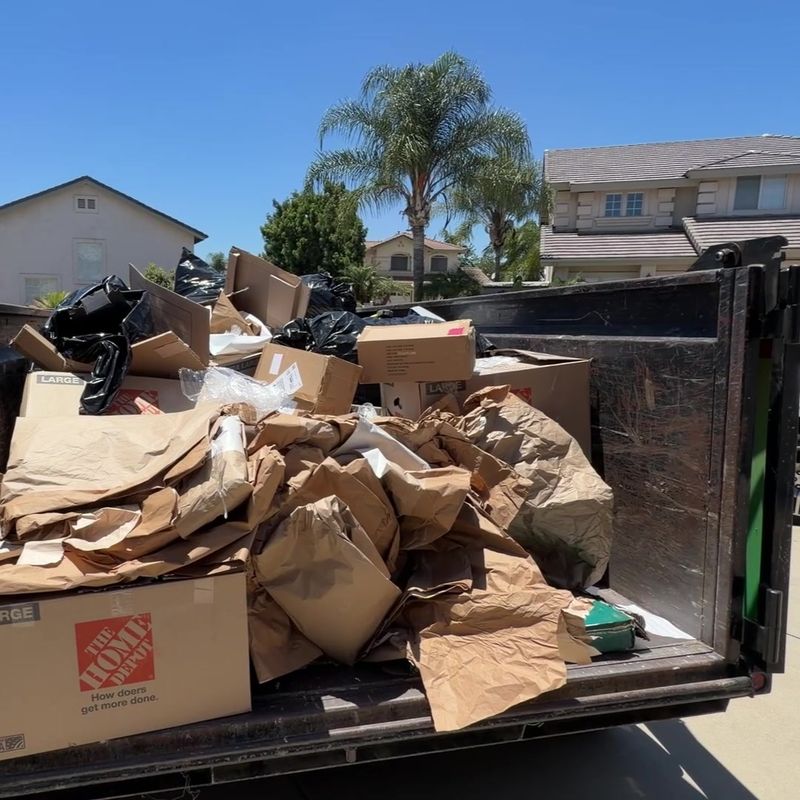 Full trailer load of cardboard hauled away from a San Dimas home